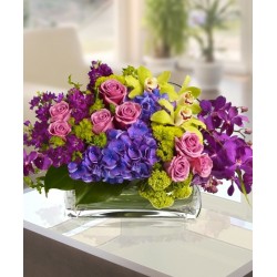 The prestigious composition, with a mix of orchids,hydrangea blue, and green stains
